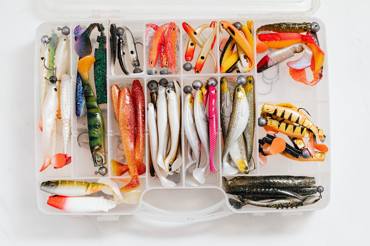 Vibrant fishing lures neatly organized in a tackle box, perfect for hobbyist anglers.